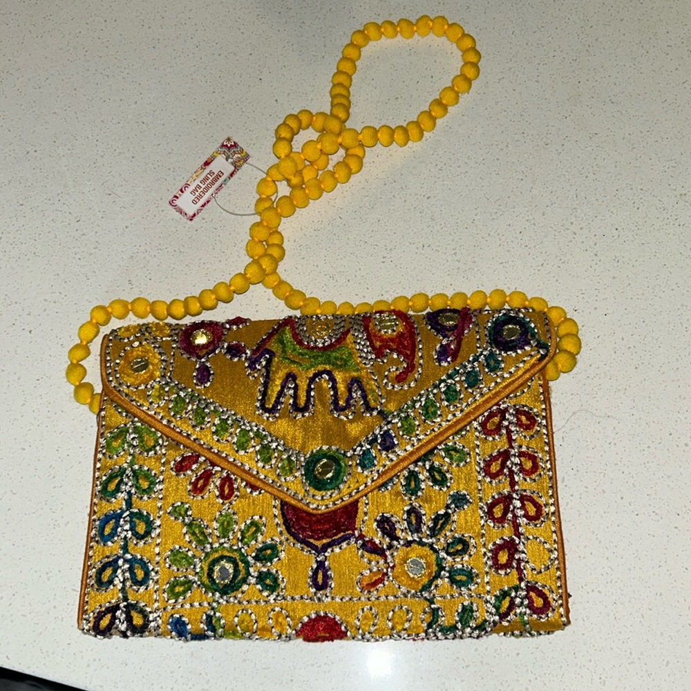 Soft embroidered sling bag
